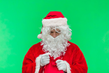 Portrait of good Santa Claus holding a red bag. Christmas and New Year concept. chroma key