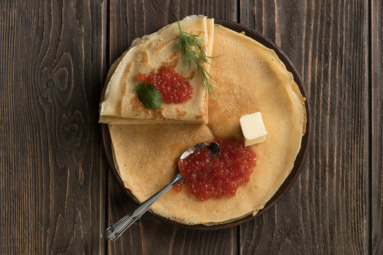 Flat lay of pancakes with red caviar
