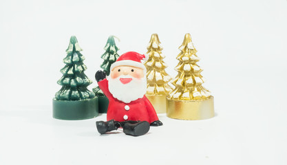 Santa Clause and snowman sitting near the golden Christmas tree candle waiting for Christmas, happy and prosperity concept