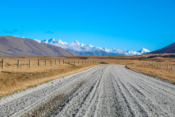 dirt road leading to mountains in Ashburton Lakes District, South Island, New Zealand