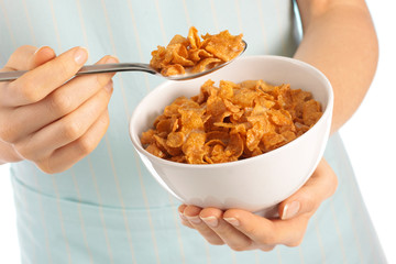 WOMAN EATING CORNFLAKES