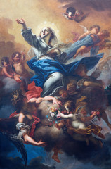 Fototapeta na wymiar PRAGUE, CZECH REPUBLIC - OCTOBER 18, 2018: The baroque painting of Assumption in church kostel Svaté Voršily by Petr Brandl (1710).