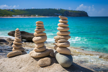 Stacks of stones in balance at a beach