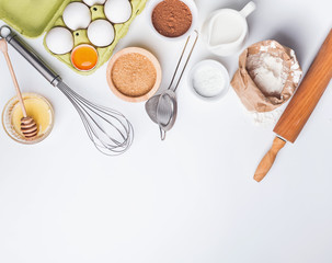 Baking ingredients on the white background, top view