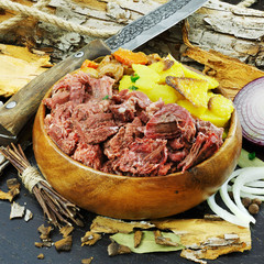 Meat pate in a wooden plate