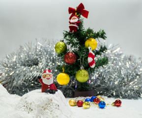 Fototapeta na wymiar Santa Clause sitting with Christmas ball waiting for Christmas