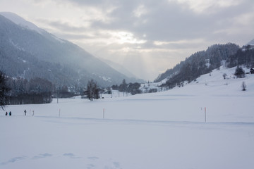 Fototapeta na wymiar Sunny winter landscape in swiss mountains in the rhone valley