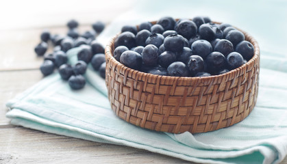 blueberry in basket against a light