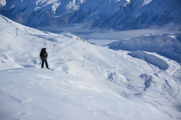 Fototapeta na wymiar Snowborder at the top of a ski slope
