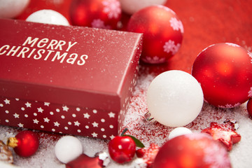 Red and white gift boxes in snow. Isolated on xmas background