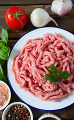 minced meat on wooden surface