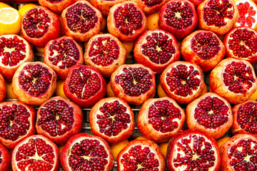 Ripe and juicy half of pomegranates ready for making juice.