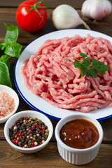 minced meat on wooden surface