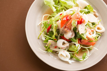 Thai Spicy salad with cuttlefish., shrimp, fish and vegetable