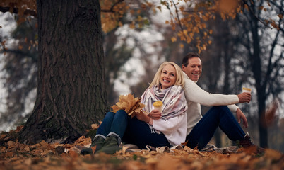 Senior couple in park in autumn