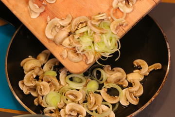 cooking mushrooms and leek onions