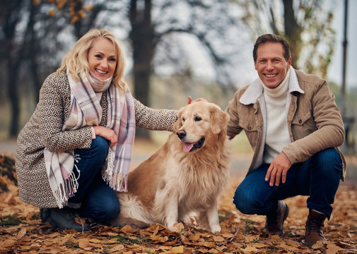 Senior couple in park in autumn