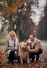 Senior couple in park in autumn