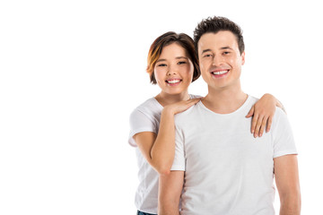 Fototapeta premium portrait of loving couple hugging and looking at camera isolated on white