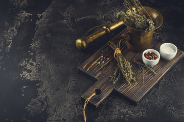Thyme. Bunch of fresh herb thyme in bronxe mortar on rusty background