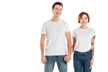 boyfriend and girlfriend holding hands and looking at camera isolated on white