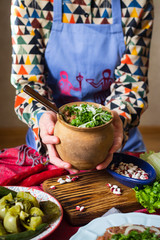 Lobio - traditional Georgian dish with red beans, cilantro, ajika spice served with pickles vegetables. Vegan vegetarian healthy food