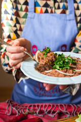 Lobio - traditional Georgian dish with red beans, cilantro, ajika spice served with pickles vegetables. Vegan vegetarian healthy food