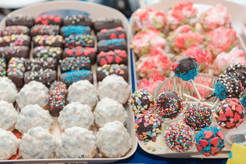 Sweet candy in chocolate on a stick. Sweets for children. Apples in chocolate on a stick.