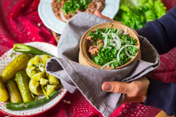 Lobio - traditional Georgian dish with red beans, cilantro, ajika spice served with pickles vegetables. Vegan vegetarian healthy food
