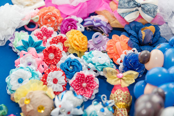 Fototapeta premium Children's hair tie. A variety of bright hair ornaments. Fashionable hair accessories.