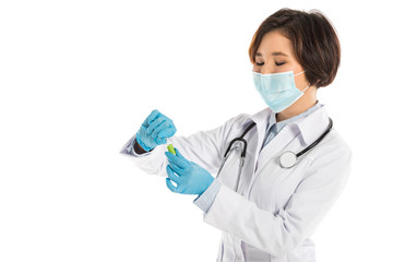 female doctor with stethoscope and medical mask holding ampule isolated on white