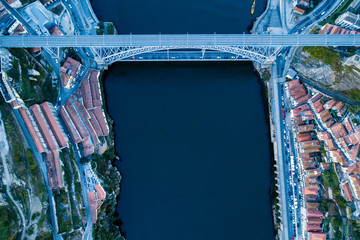Aerial view of Douro river and Dom Luis I iron bridge in Porto, Portugal. - obrazy, fototapety, plakaty