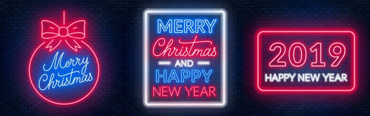 Merry Christmas and happy new year neon lettering on dark background.