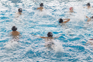 water polo competition in a pool for children and adolescents. water sports and swimming pool championship. © Ivan