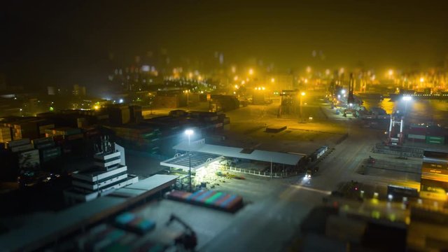 night time illuminated shenzhen city famous working port aerial panorama 4k tilt shift timelapse china
