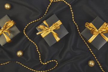 Luxury black gift boxes with gold ribbon