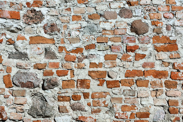 wall of red brick and stone