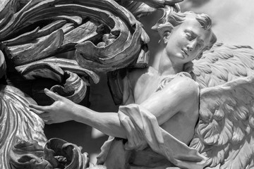 PRAGUE, CZECH REPUBLIC - OCTOBER 12, 2018: The carved polychrome baroque statue of angel from the side altar in St. Francis of Assisi church by  M. V. Jäckel a J. K. Liška. (17. - 18. cent.).