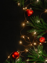 Dark magic background card for Christmas or New Year. Bright blurry lights of a garland. Place for greeting text.