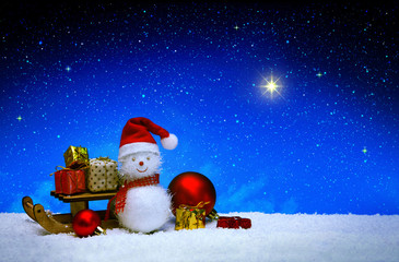Christmas snowman with santa claus hat isolated on star sky background.