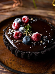 Tart Chocolate cheesecake with fresh berries. delicious dessert for Birthday.