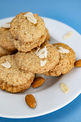Gluten-Free Cookies almond with almond slice in white plate.