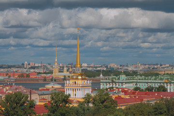Fototapeta na wymiar Roofs and city under clouds. St. Petersburg, Russia