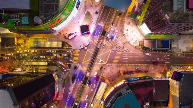 sunset illuminated kuala lumpur city center traffic crossroad aerial panorama timelapse 4k malaysia
