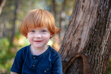 Redhead boy with long hair