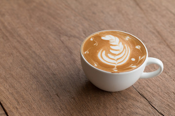 Latte art in a cup topping beautiful art from milk
