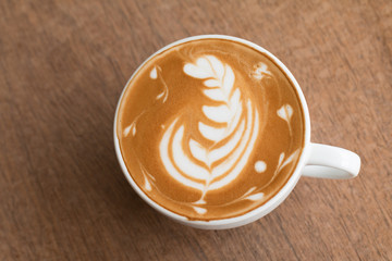Latte art in a cup topping beautiful art from milk