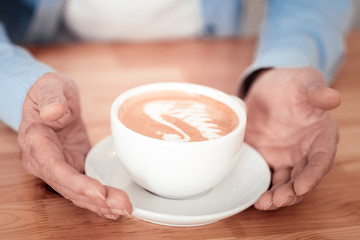 Cup of delicious coffee being served