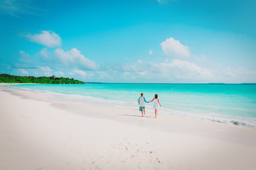 Fototapeta na wymiar happy loving couple run enjoy tropical beach