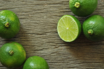 limes slices on wooden table. Detox diet, fresh lime Background, Close up shot, fruit macro photography